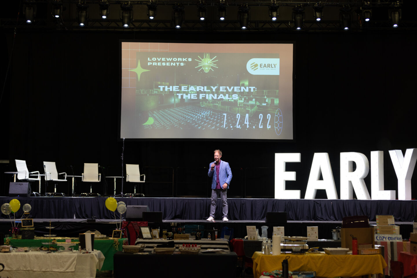 Man on stage speaking at a non-profit event in Oklahoma City - Cultivate Event Planning