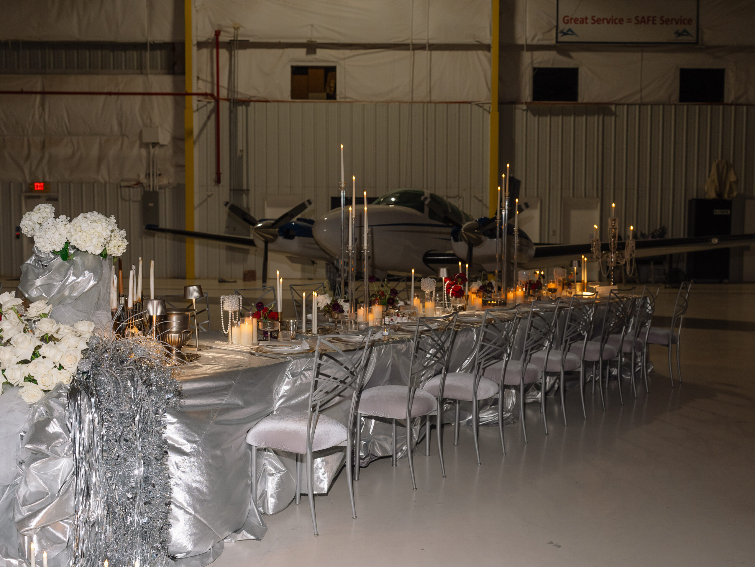 Corporate event set up in an airplane hangar.