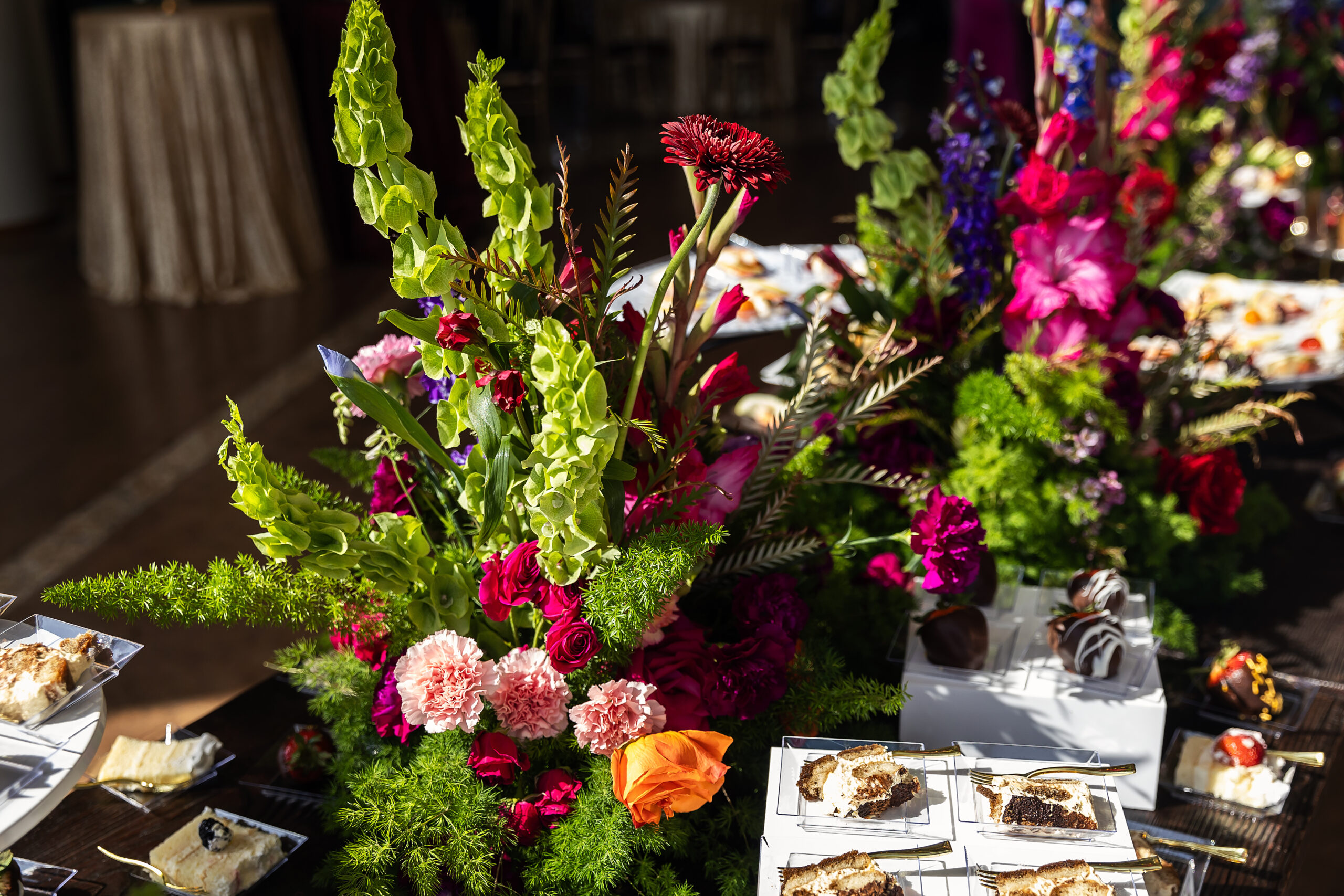 Colorful flower arrangement on table at corporate event. Corporate Event Planning OKC - Cultivate Event Planning