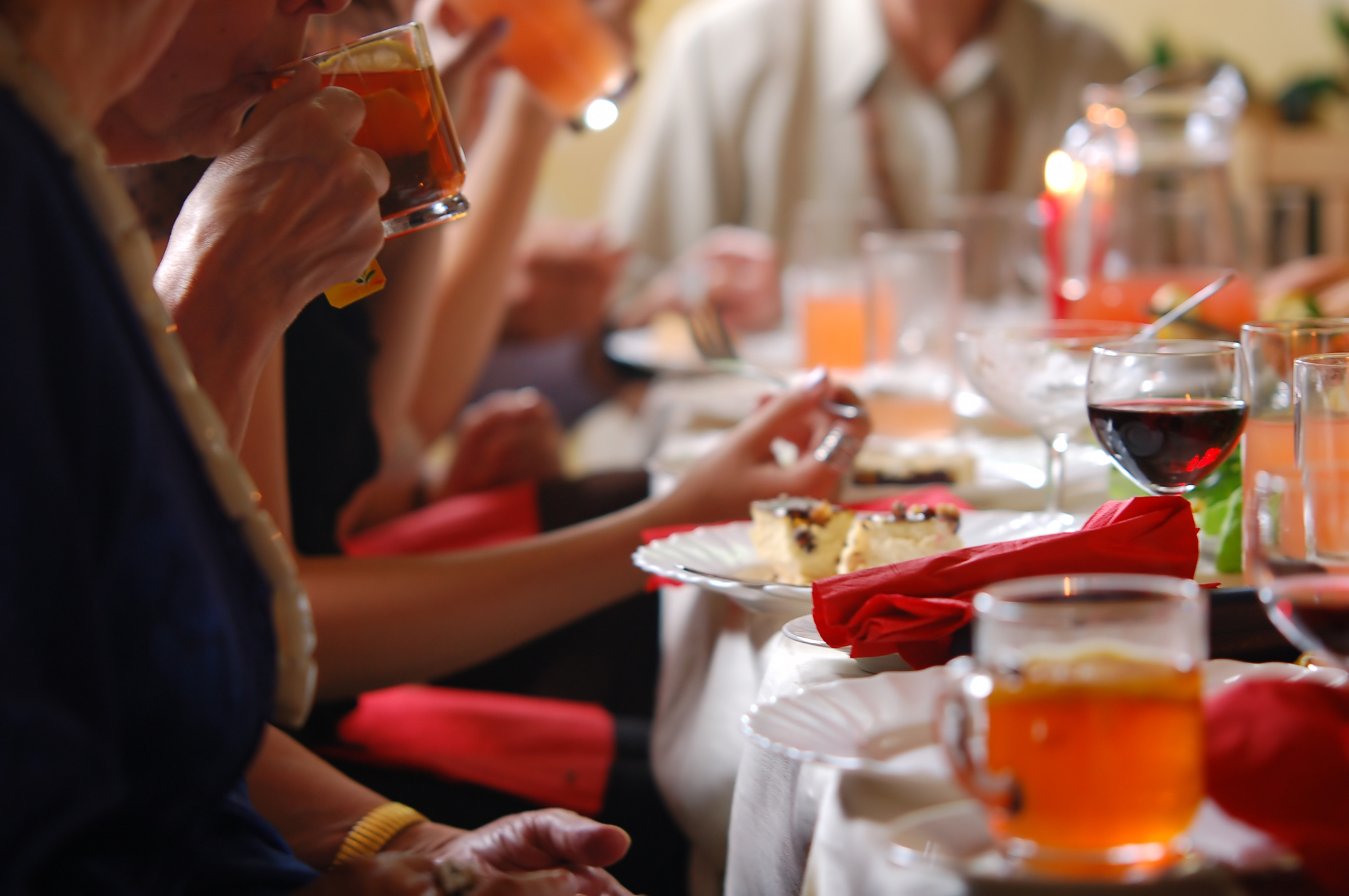 Reception setting. People sitting around the table. Private Event Planner - Cultivate Event Planning