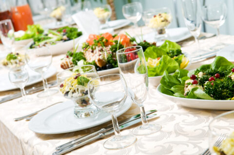 Catering table set service with silverware and glass stemware at restaurant before party. Private Event Planning - Cultivate Event Planning 
