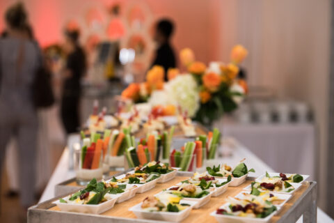 Healthy organic gluten-free delicious green snacks salads on catering table during corporate event. corporate event planning - Cultivate Event Planning
